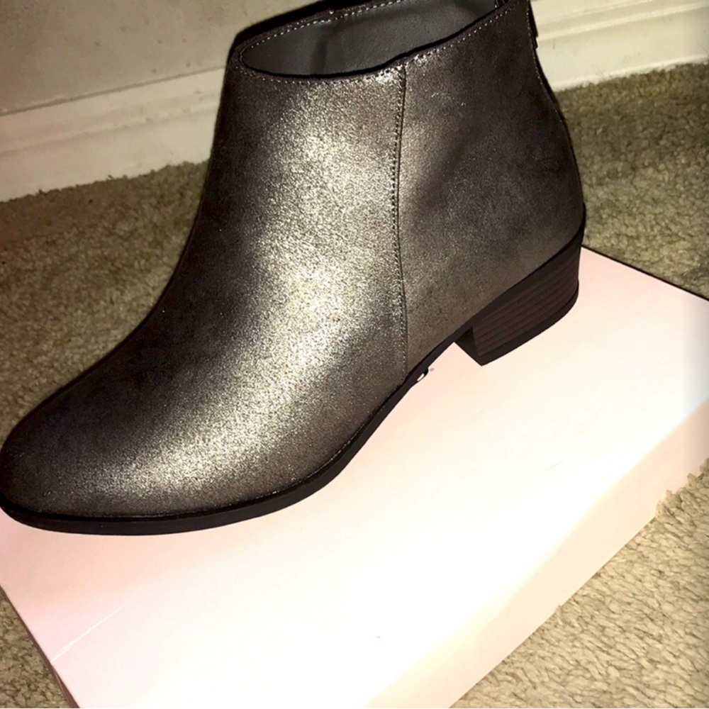 Never worn…cute boots w/ a silver glitter sparkle